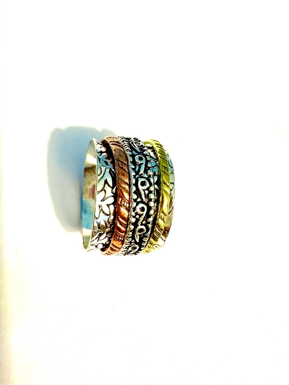 Beautiful 3 bands,, silver, brass, and copper, spin ring, size 7 .